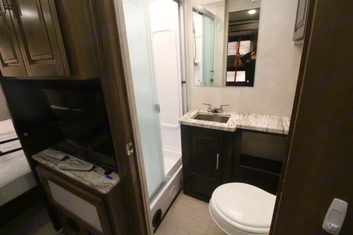 Bathroom — vanity, sink and toilet